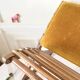 Old wooden rocking footrest with velvet fabric