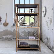Rattan bookshelf and black glasses