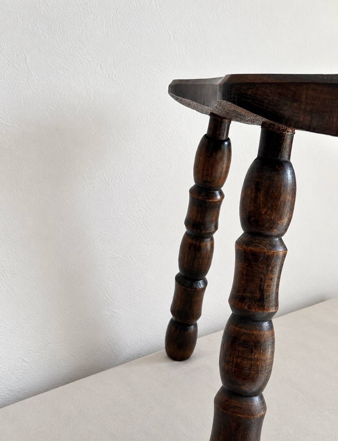 Restored dark wood tripod stool, bobbin leg, elegant furniture.