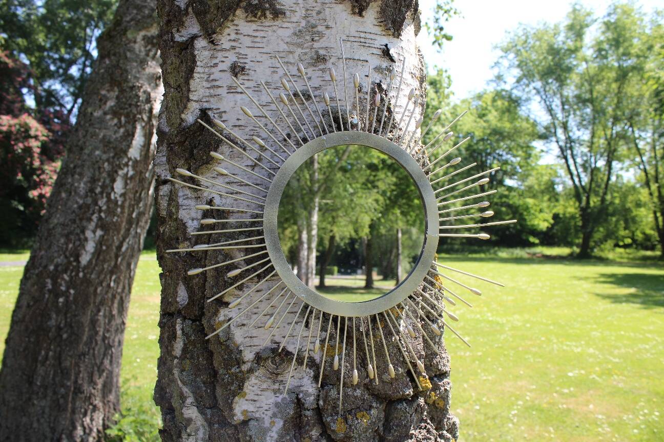 Miroir soleil métal doré