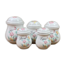 Series of white ceramic spice pots floral decoration