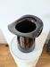Large black glass vase topped with a 70s hat