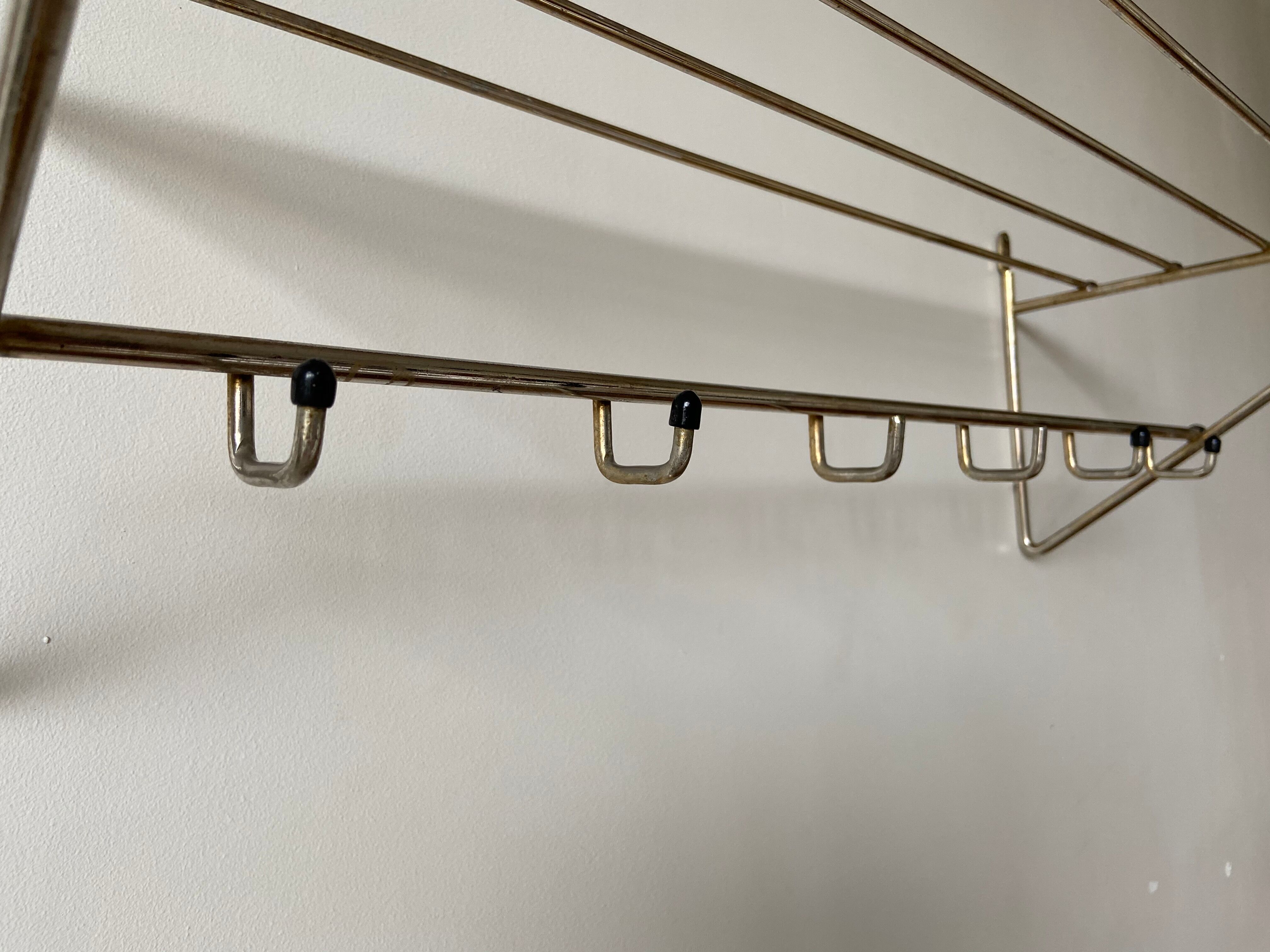 Metal wall coat holder with tablet