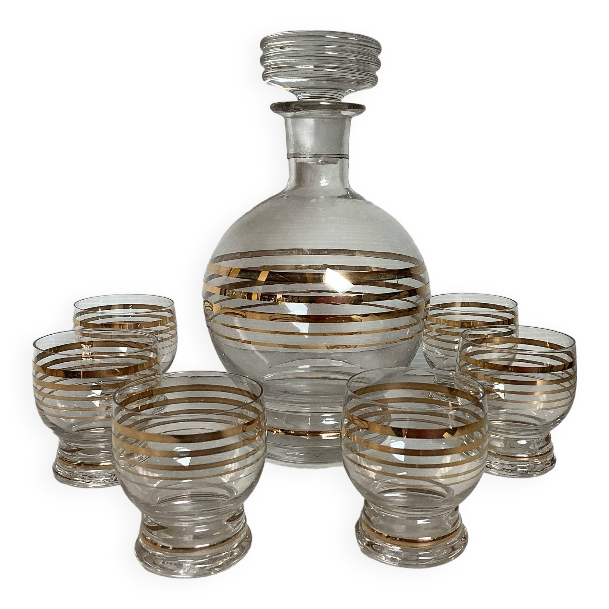 Antique liqueur set with a gold rim.