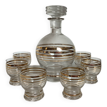 Antique liqueur set with a gold rim.