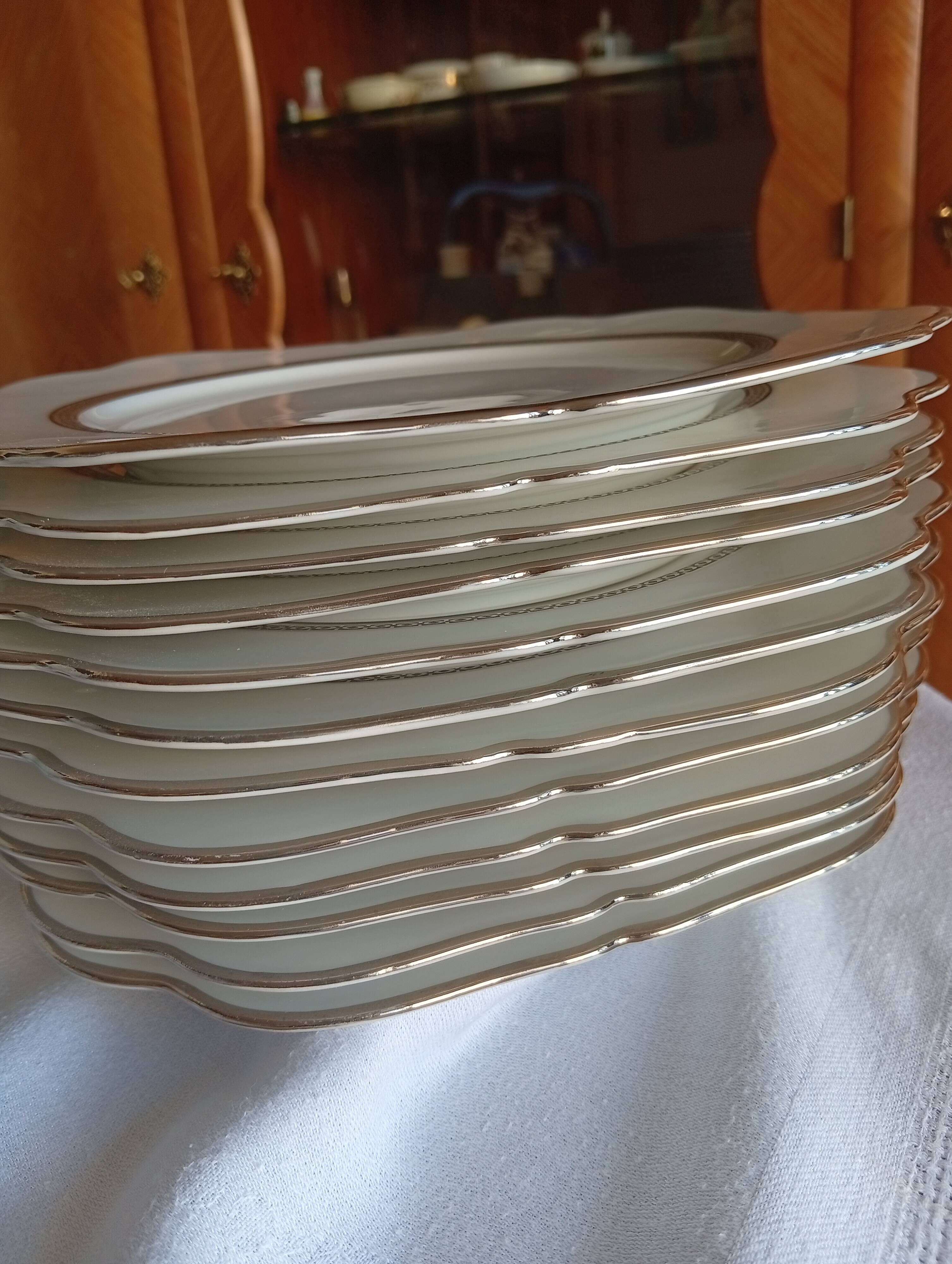 Jean BOYER Limoges FRANCE part of a white porcelain table service.