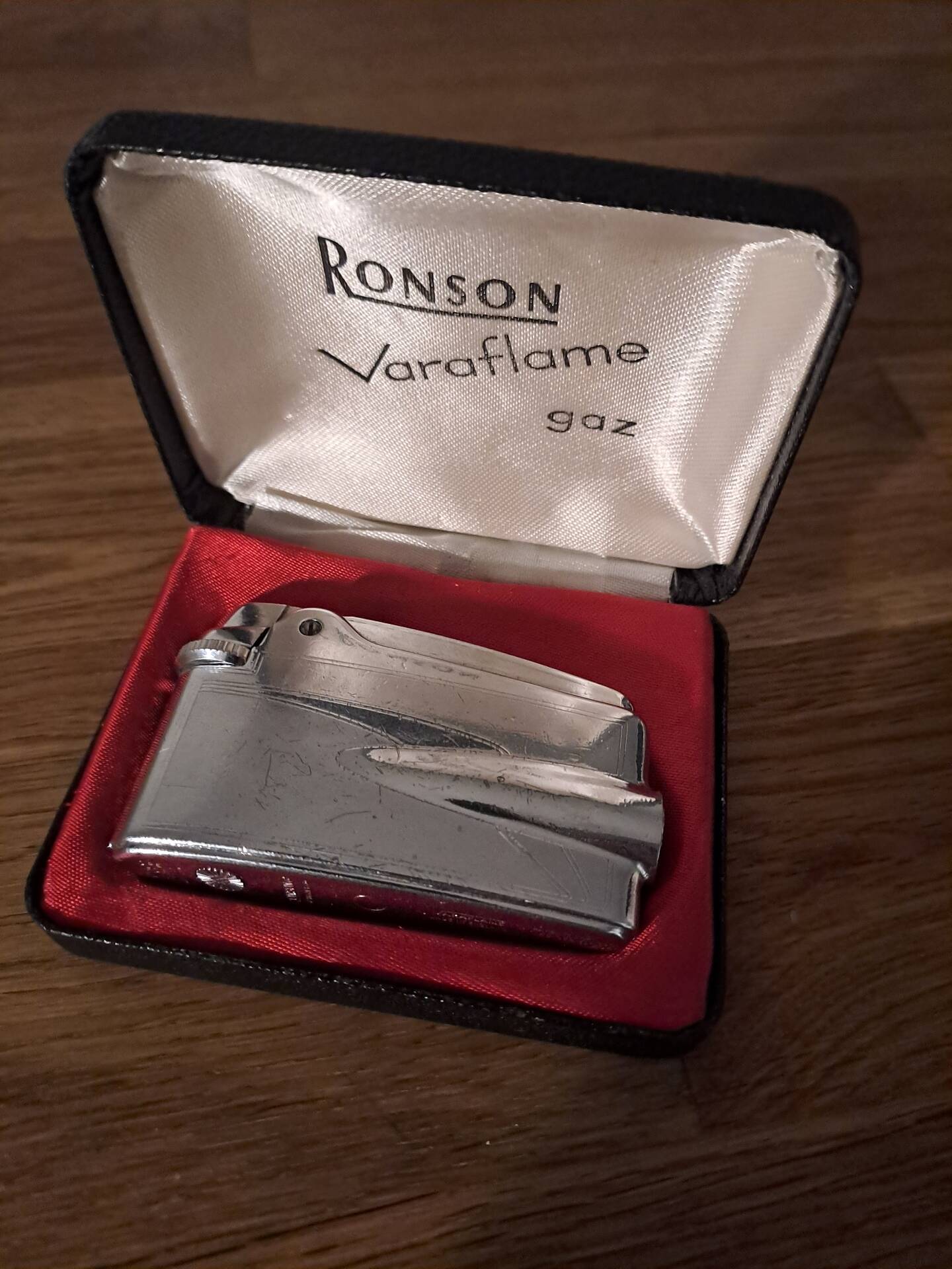 Vintage Ronson Varaflame chrome lighter and its original case.