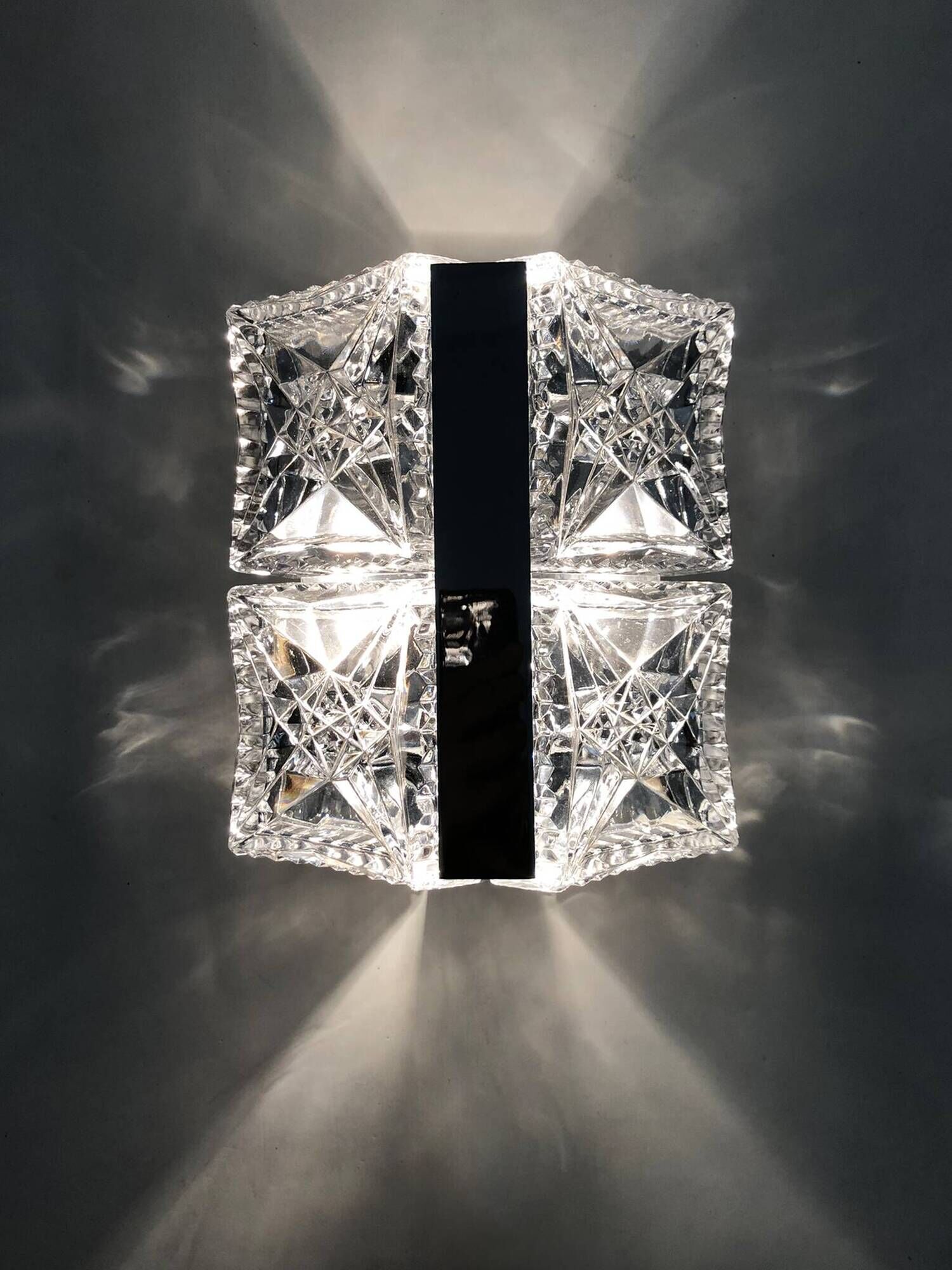 Pair of modernist 1970s glass and chrome metal wall sconces