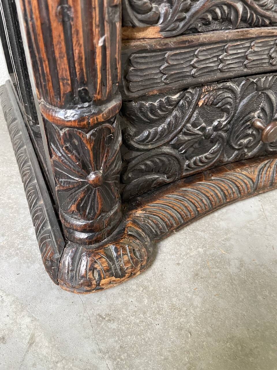19th century chest of drawers in carved blackened pine