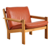 Brutalist armchair in oak and leather by Tage Poulsen, Denmark, 1970s.