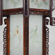 Asian wooden lantern carved with dragons and painted glass panels
