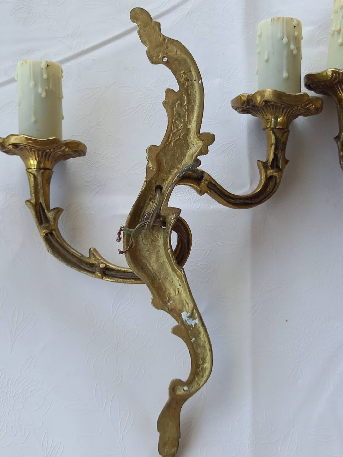 Old pairs of bronze wall sconces