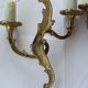Old pairs of bronze wall sconces