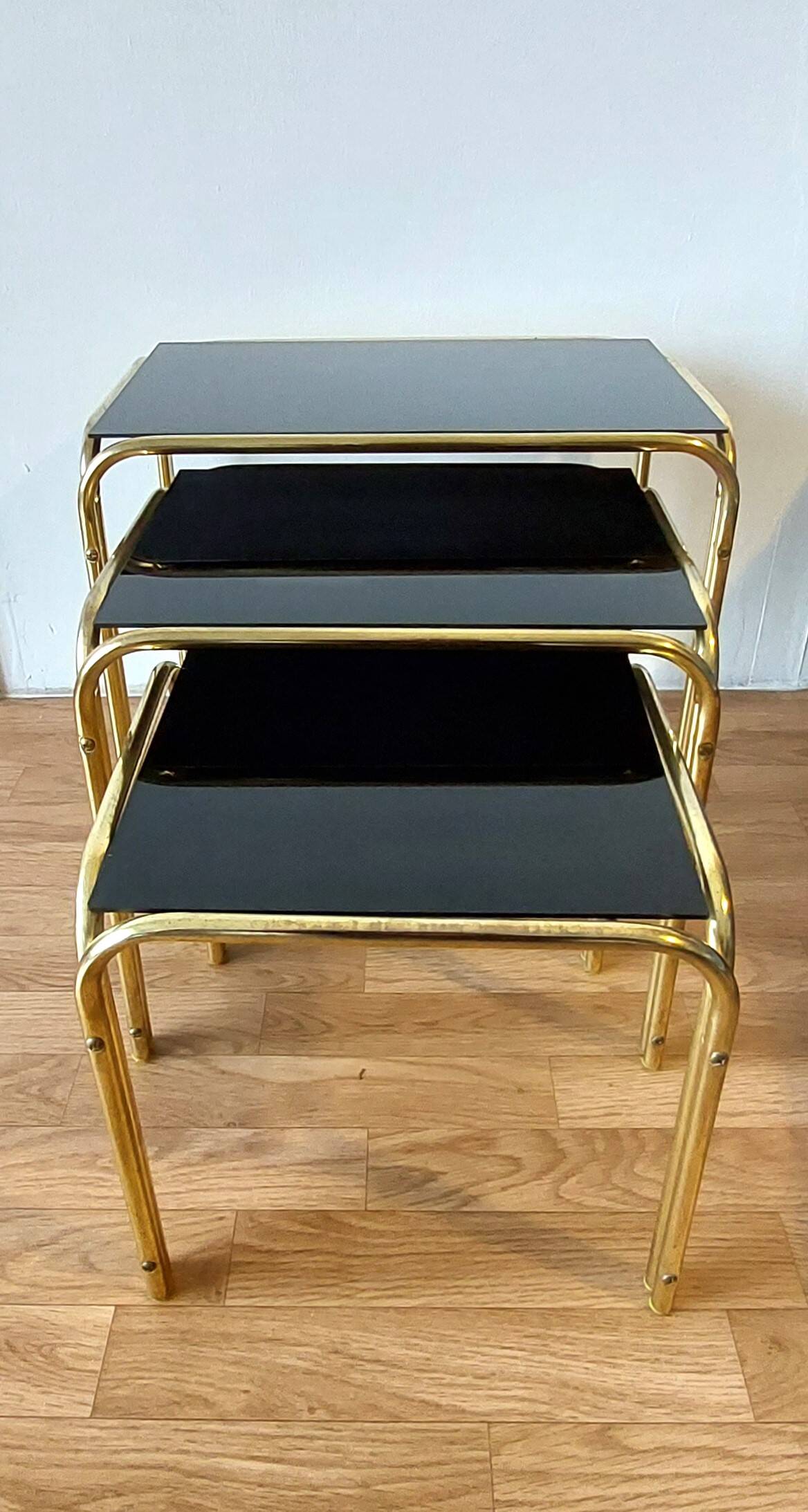 Vintage 1970 gold metal nesting tables.