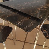 Table and 6 chairs in black formica marble effect