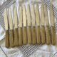 Set of 11 Apollonox table knives in a box