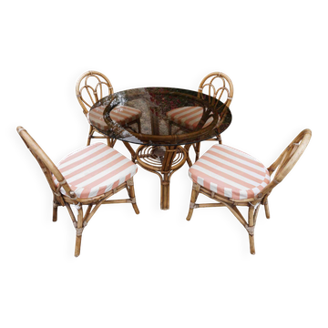 dining table and chairs made of curved bamboo and rattan with smoked glass from the 1970s