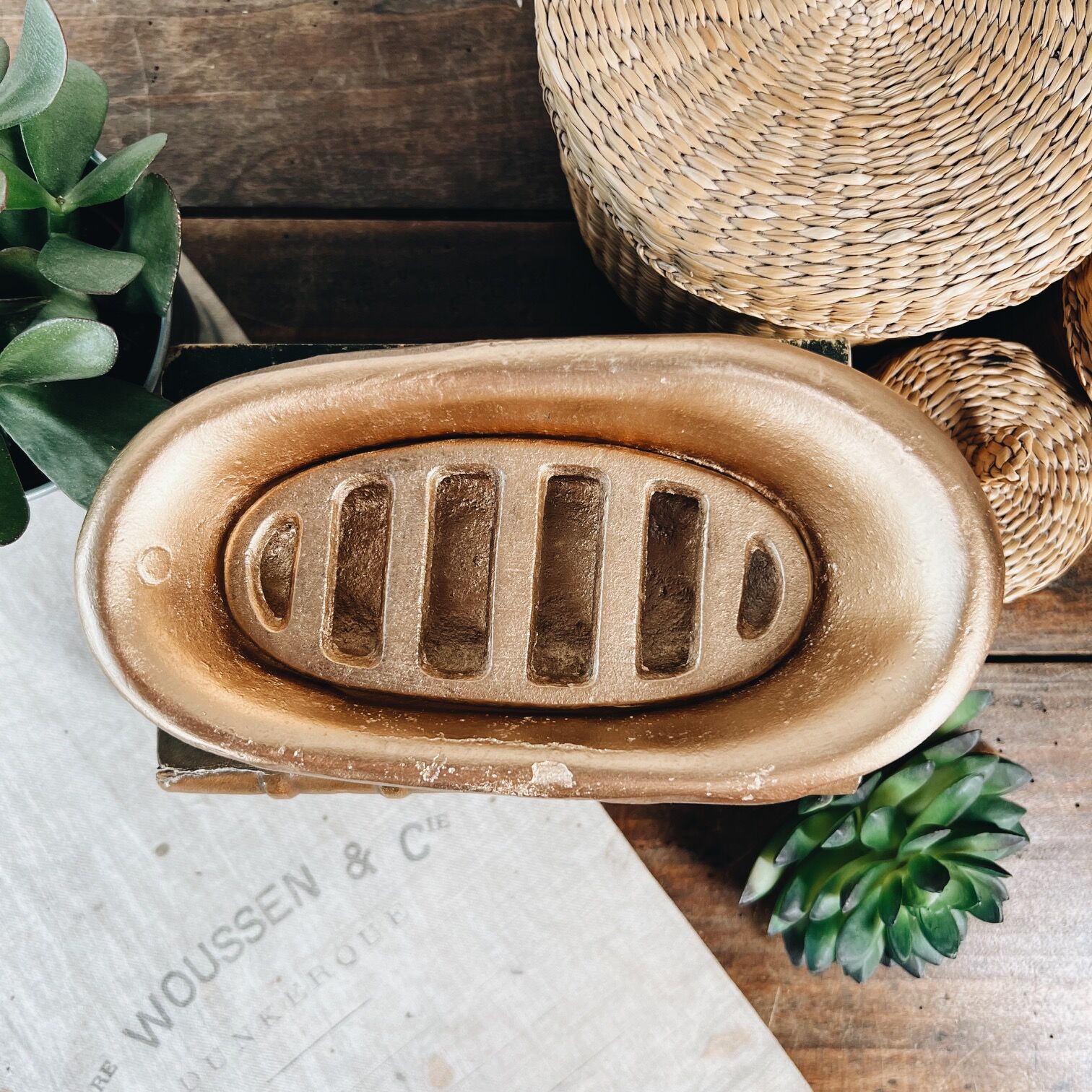 Cast iron soap dish in the shape of a bathtub