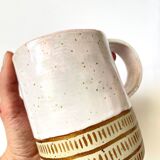 Handmade golden ceramic mug