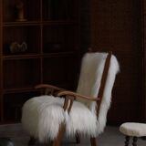 Pair of Scandinavian armchairs in oak and long-haired Icelandic sheepskin by Henning Kjærnulf, 1950.