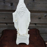 Ancient statuette of the virgin with the serpent in biscuit