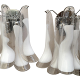 Wall sconces in white and transparent murano glass "saddle"