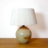 Large stone lamp with a cotton shade.