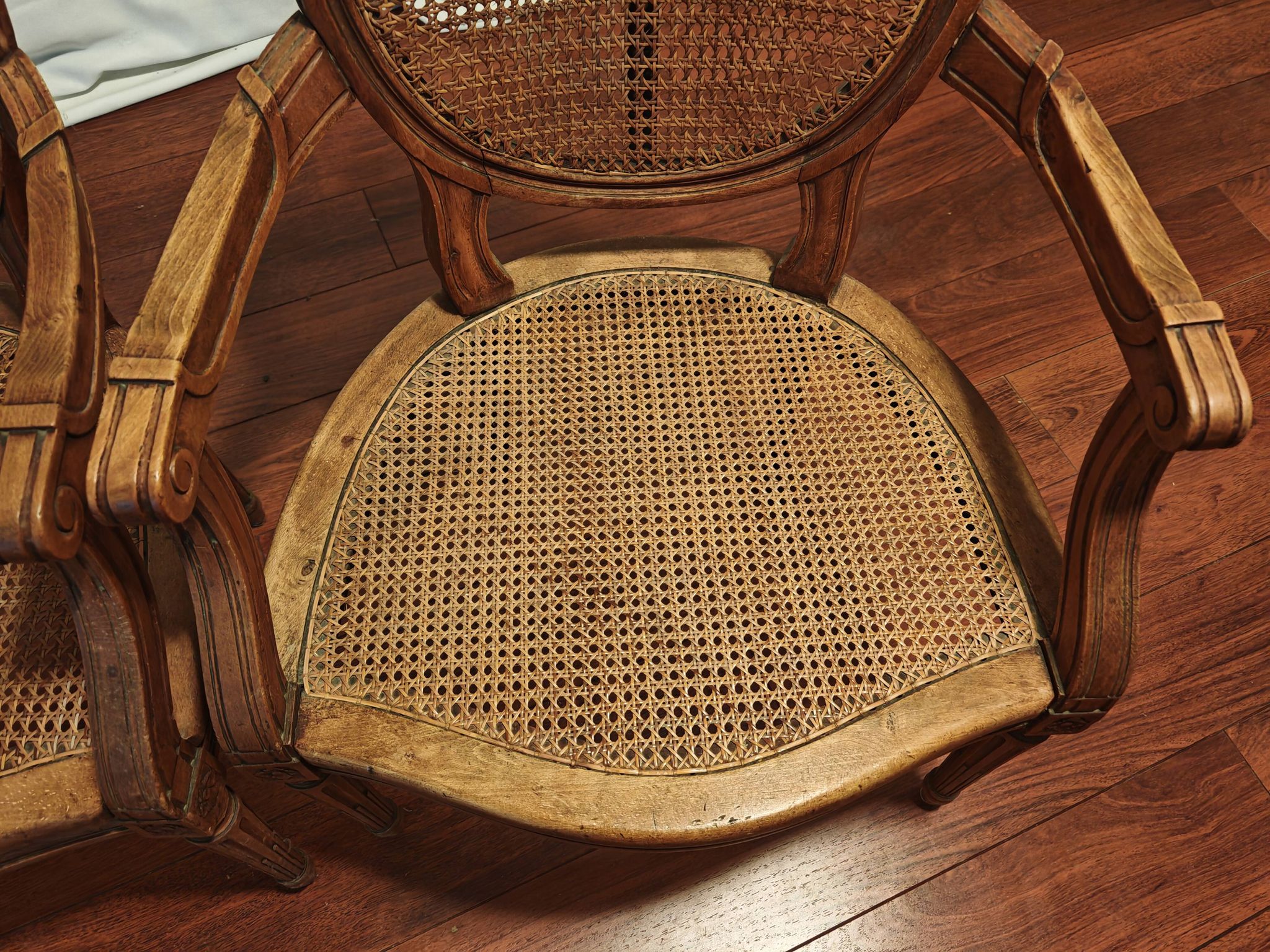 Caned armchairs