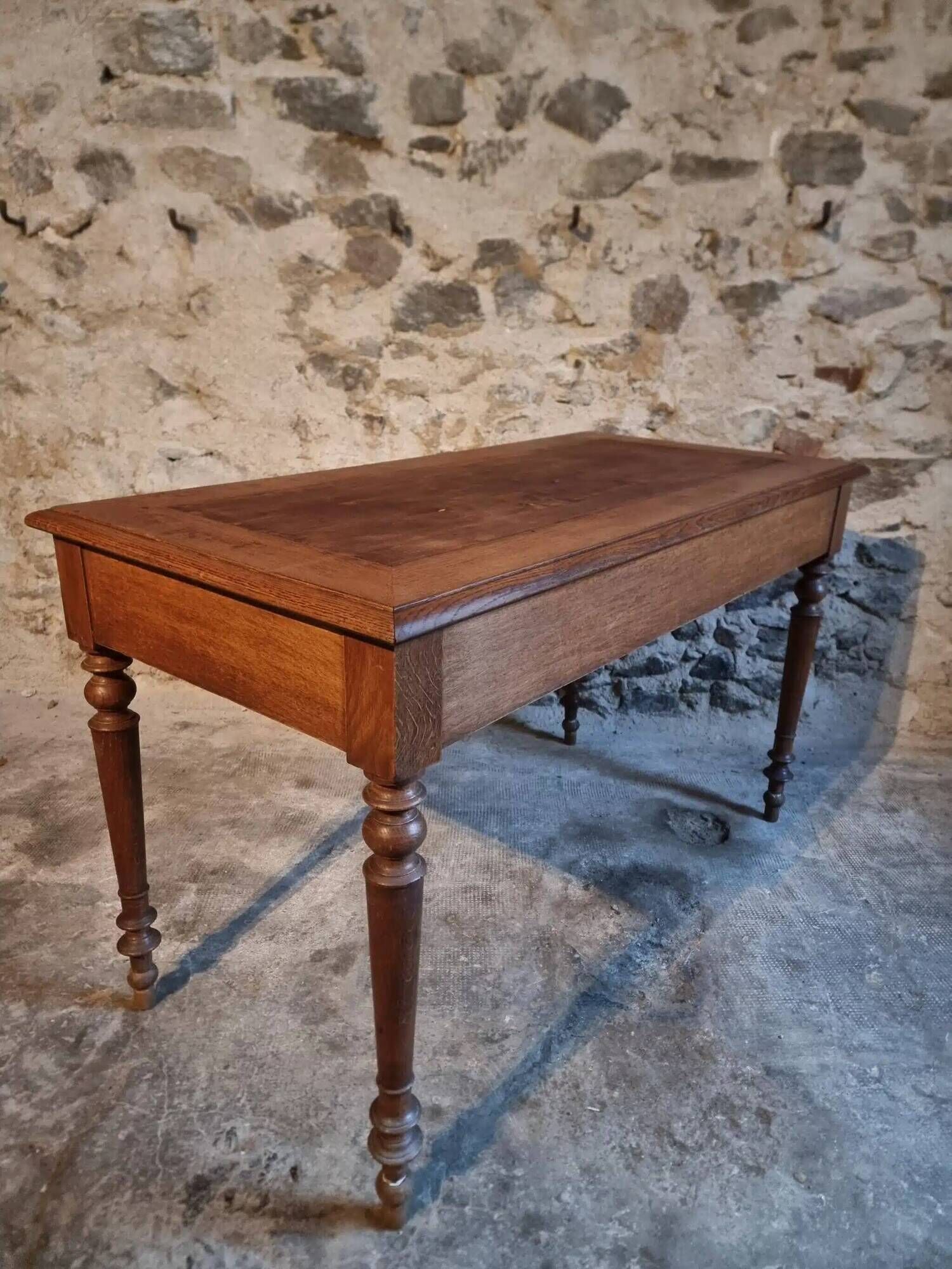 Antique French writing desk in oak with two drawers, 1920s.