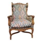 Bergere à oreilles en bois sculpté de style régence