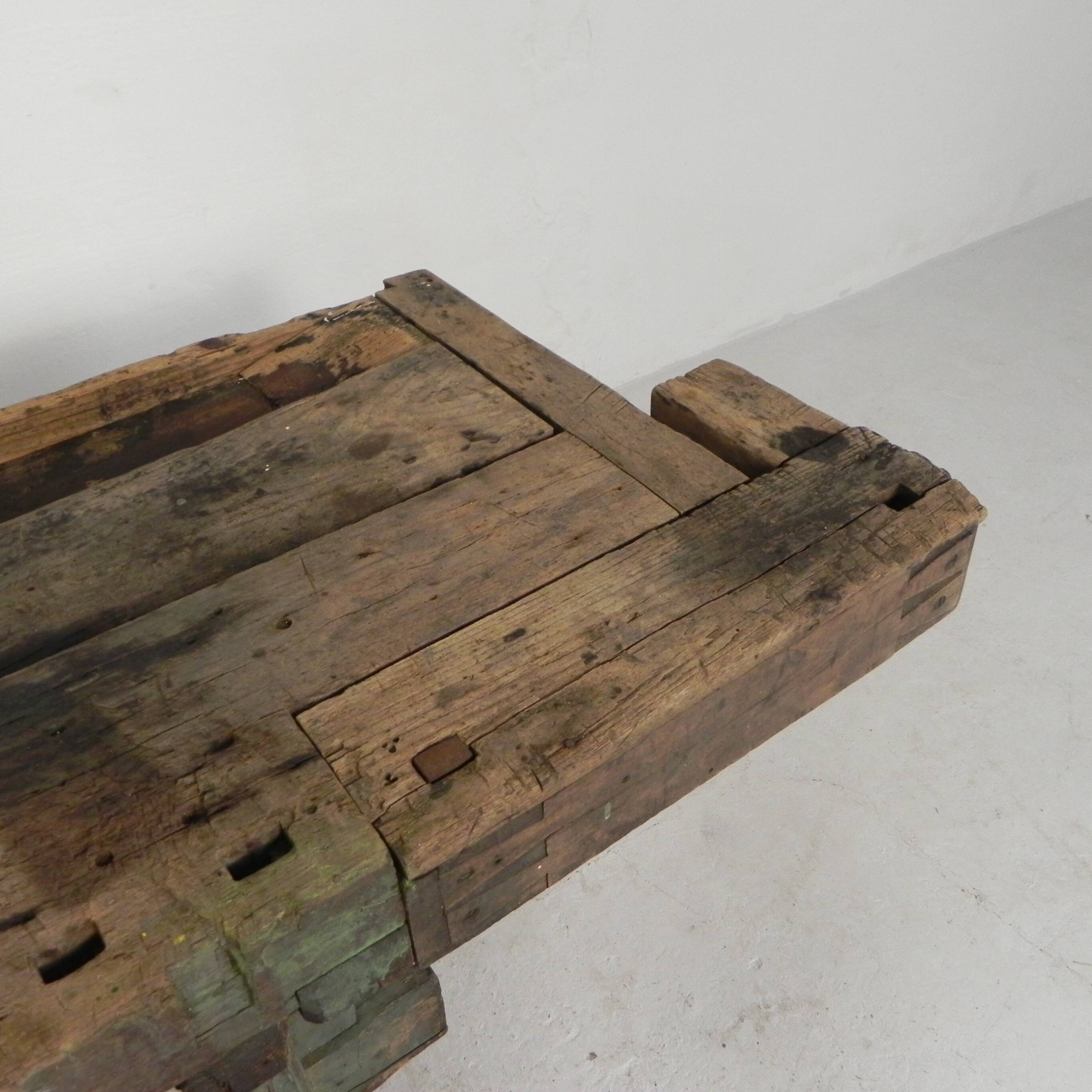 Wooden industrial workbench with vice, 194 cm long, 1930s.