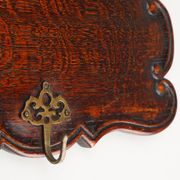 Art Nouveau style coat rack in oak with brass hooks, France ca. 1915