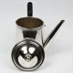 Christofle teapot in silver-plated metal, with a blackened wood handle — late 19th century, early 20th century.