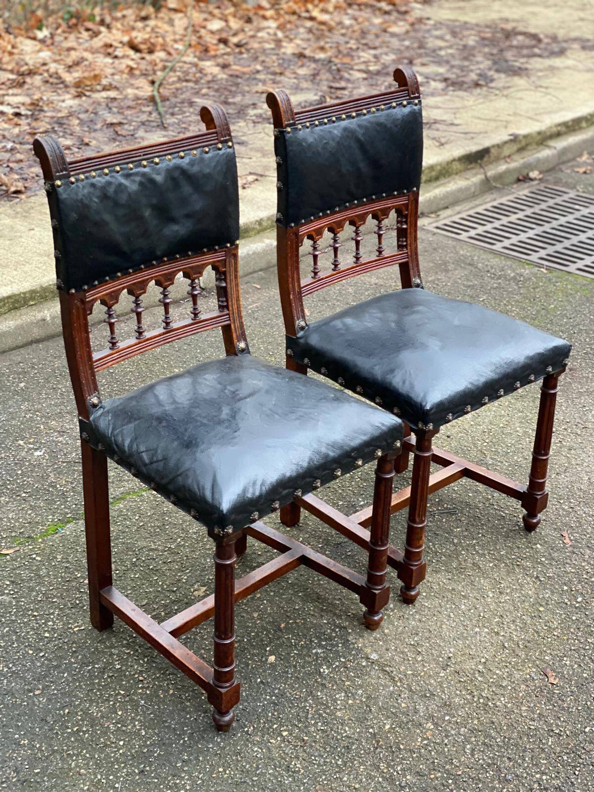 Two 19th-century Henri II chairs in solid wood and black leather upholstery