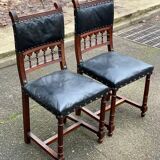 Two 19th-century Henri II chairs in solid wood and black leather upholstery