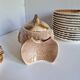 Many flat plates, dish, sauce boat, vegetable dish.