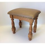 Rustic tabouret on leather