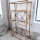 Rattan bookshelf and black glasses