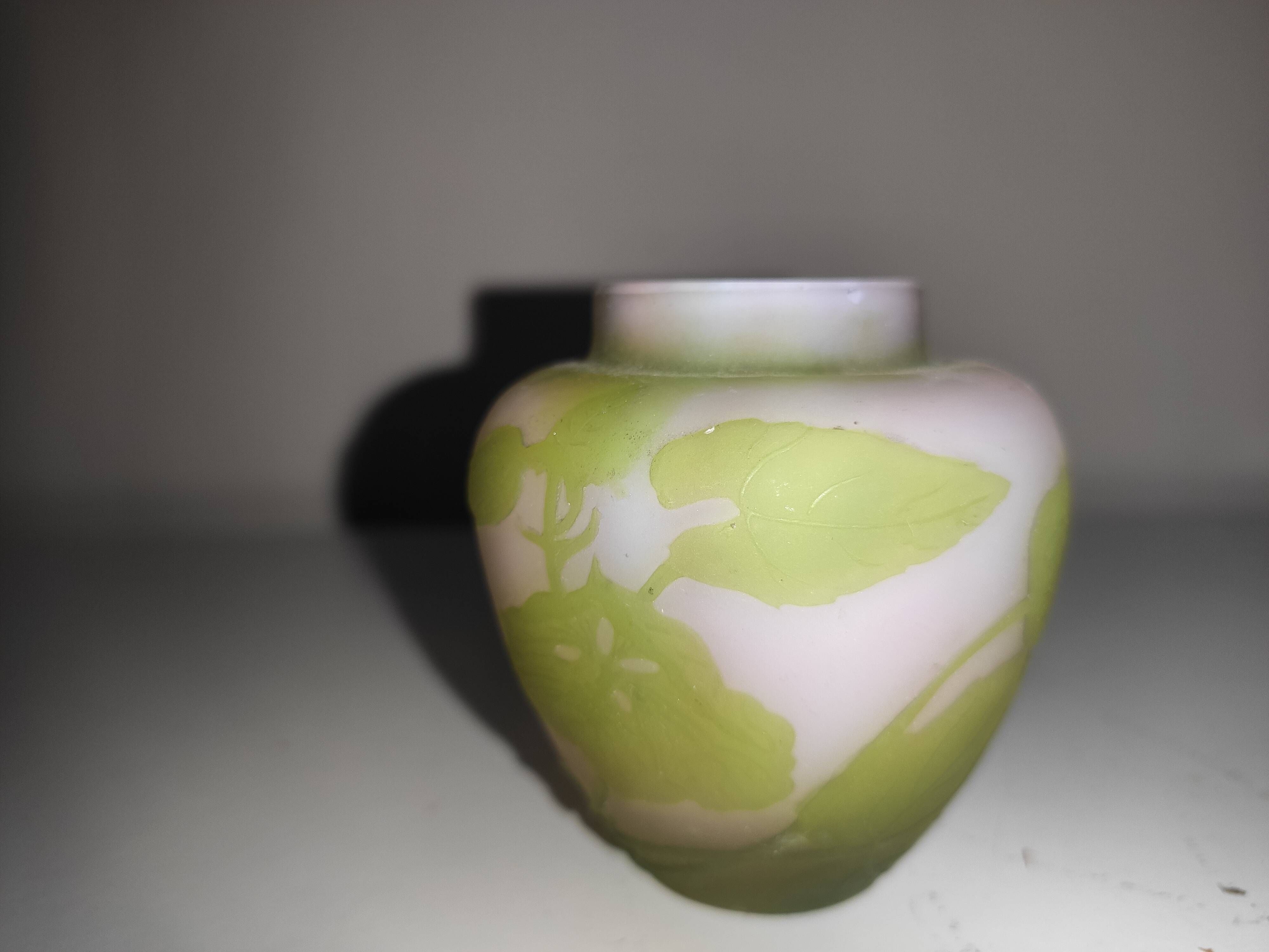 Small E. Gallé vase, "star" signature, light green tone on white background.