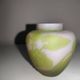 Small E. Gallé vase, "star" signature, light green tone on white background.