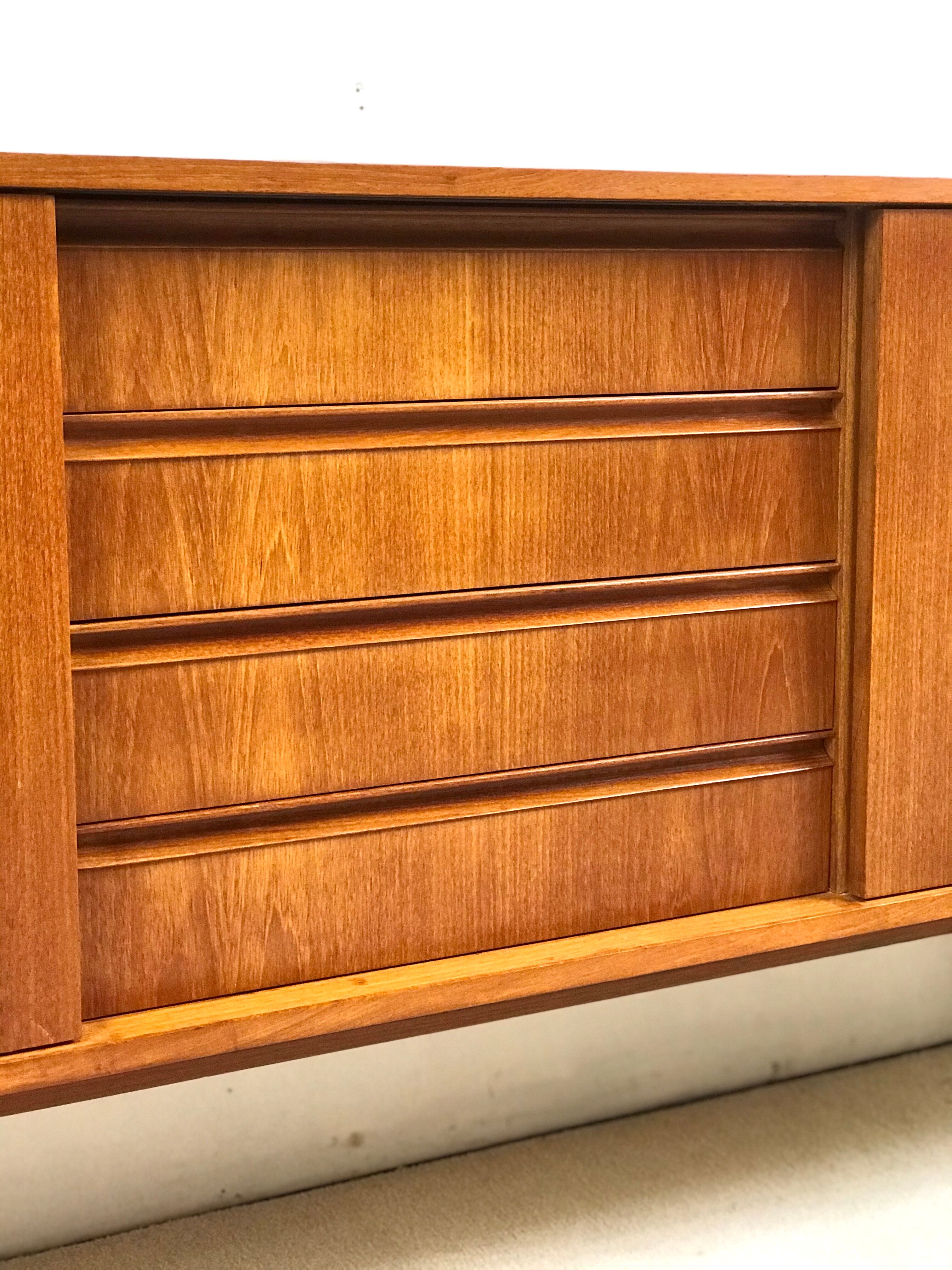 Danish teak sideboard with two sliding doors and 4 central drawers