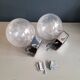 Pair of vintage wall lights in chrome metal with bubbled glass globes.