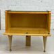 Pair of bedside tables in wood, brass and black glass top