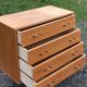 Vintage oak chest of drawers with 4 drawers from the 1960s.