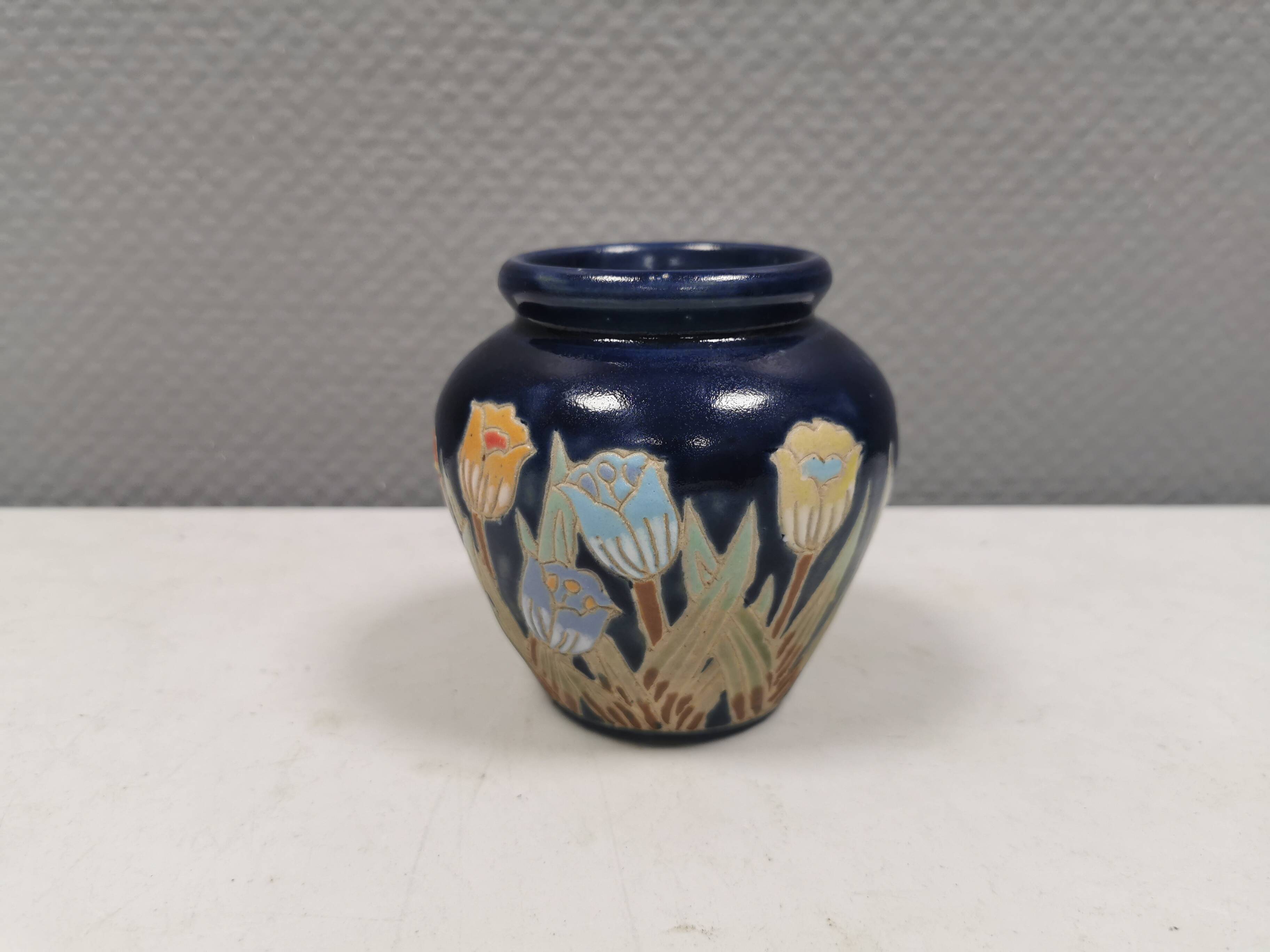 Small delicious blue ceramic vase with floral decoration. Sweden 1970s