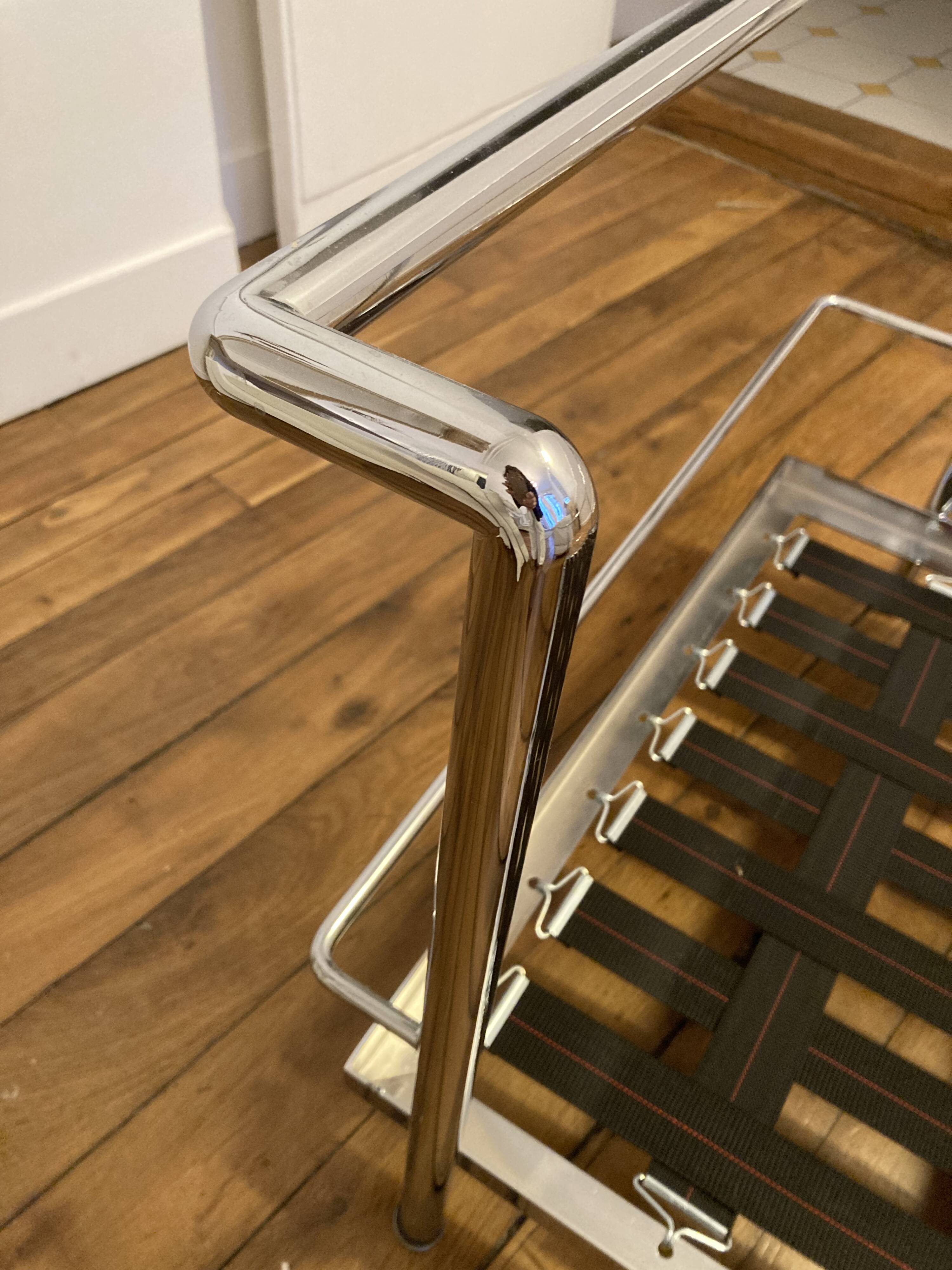 Pair of white leather and chrome armchairs