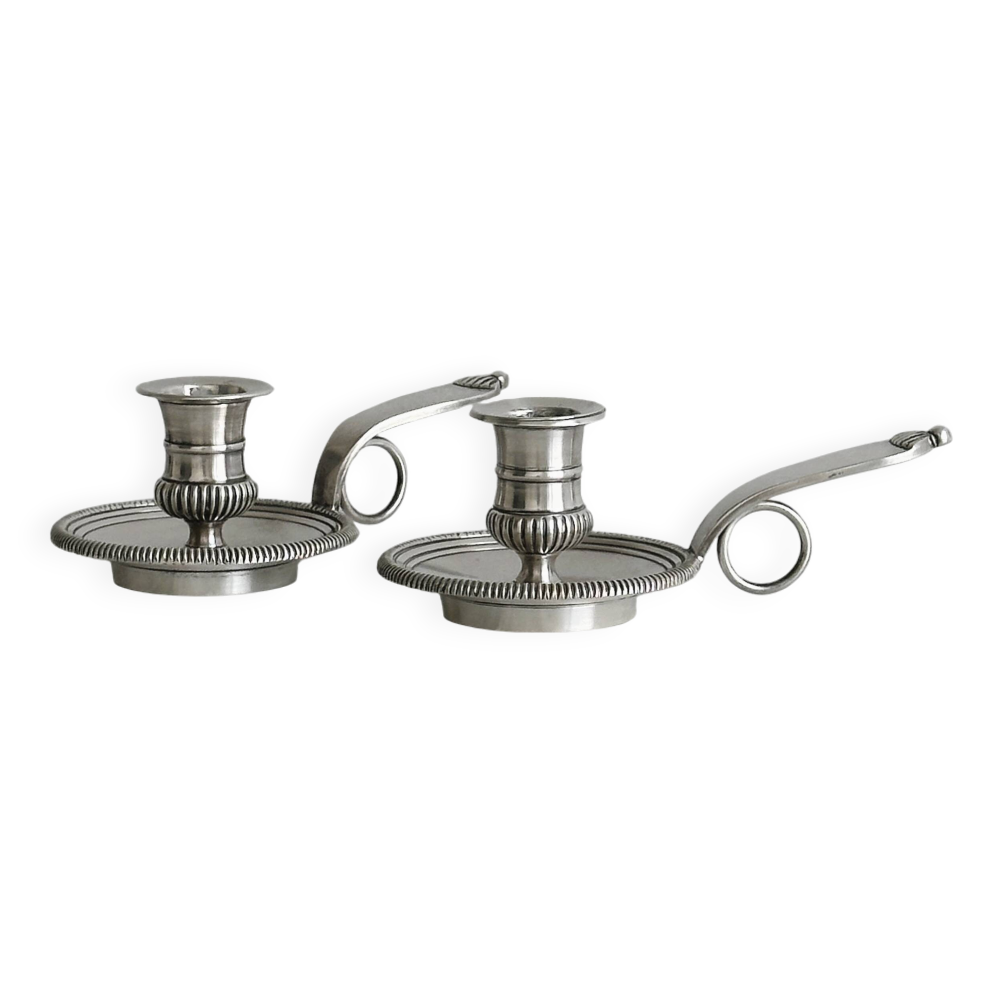 Pair of shiny silver metal candlesticks