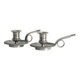 Pair of shiny silver metal candlesticks