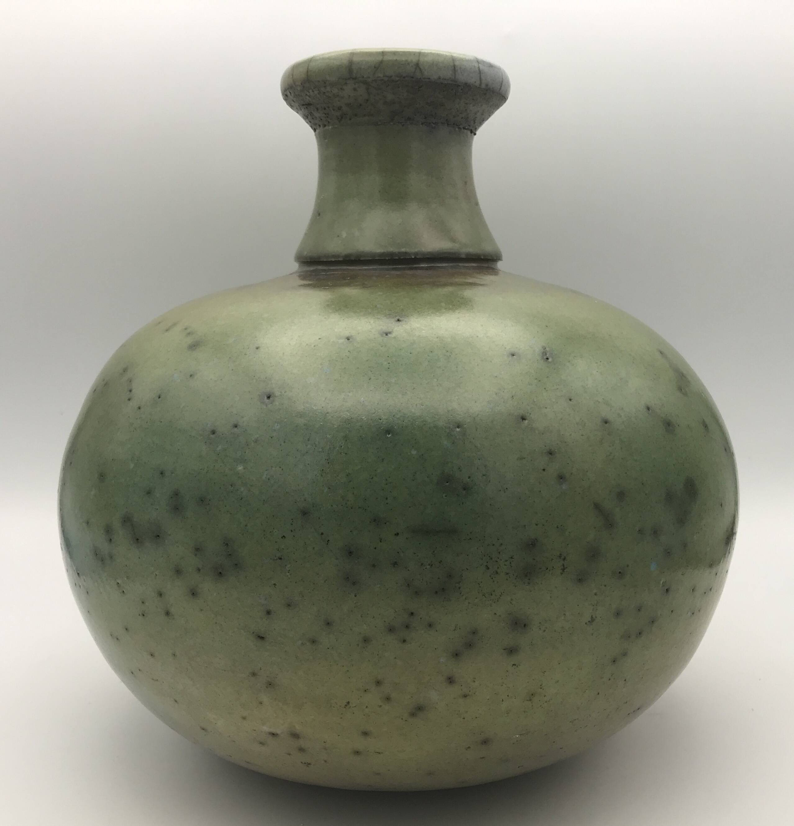 Contemporary vase ball shape raku shades of green and yellow
