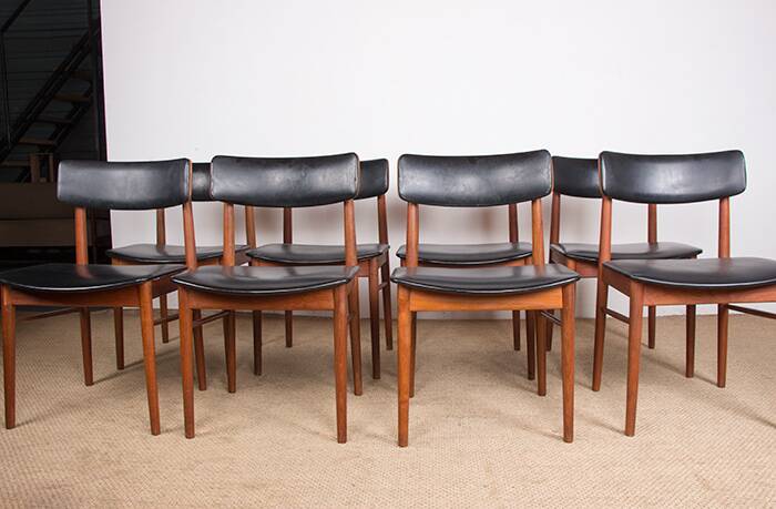 Set of 8 Danish chairs in teak, black leatherette and brass, Sven Chrobat/Sax.